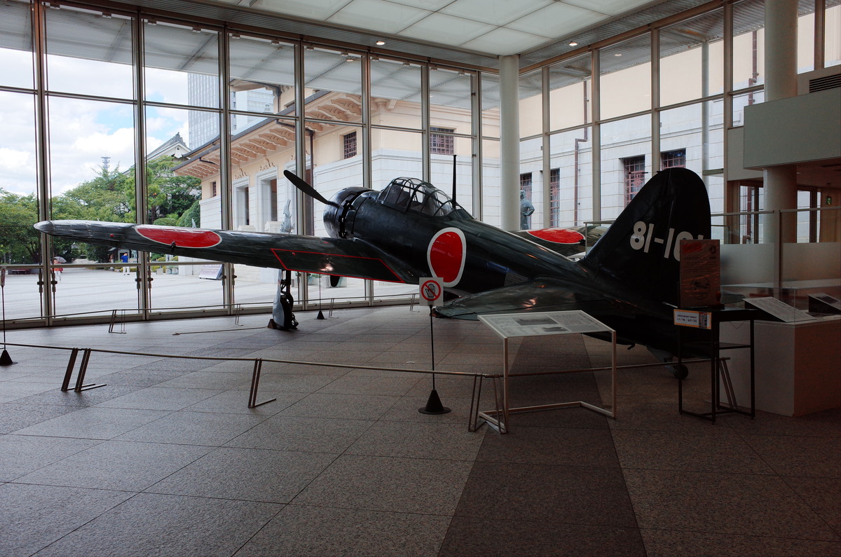 An A6M Zero fighter plane in the lobby of the Yushukan Museum.