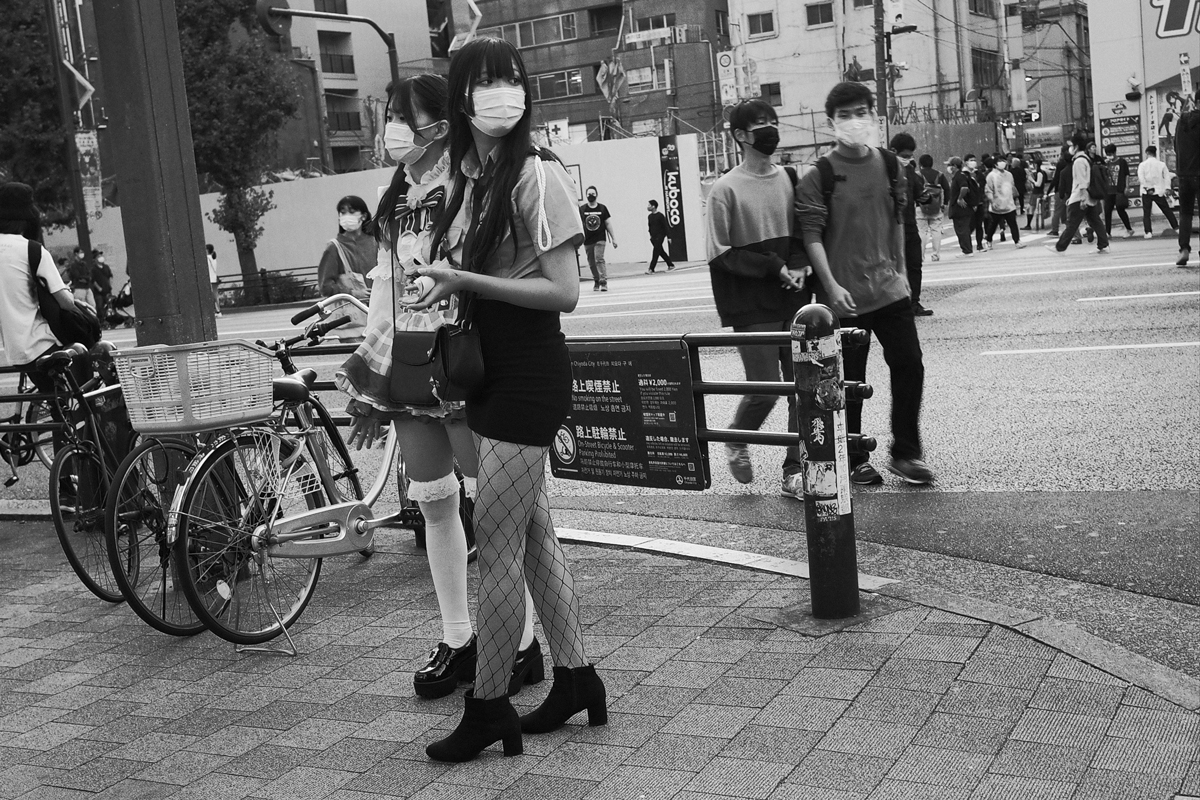 Two young woman in skirts in Akihabara.