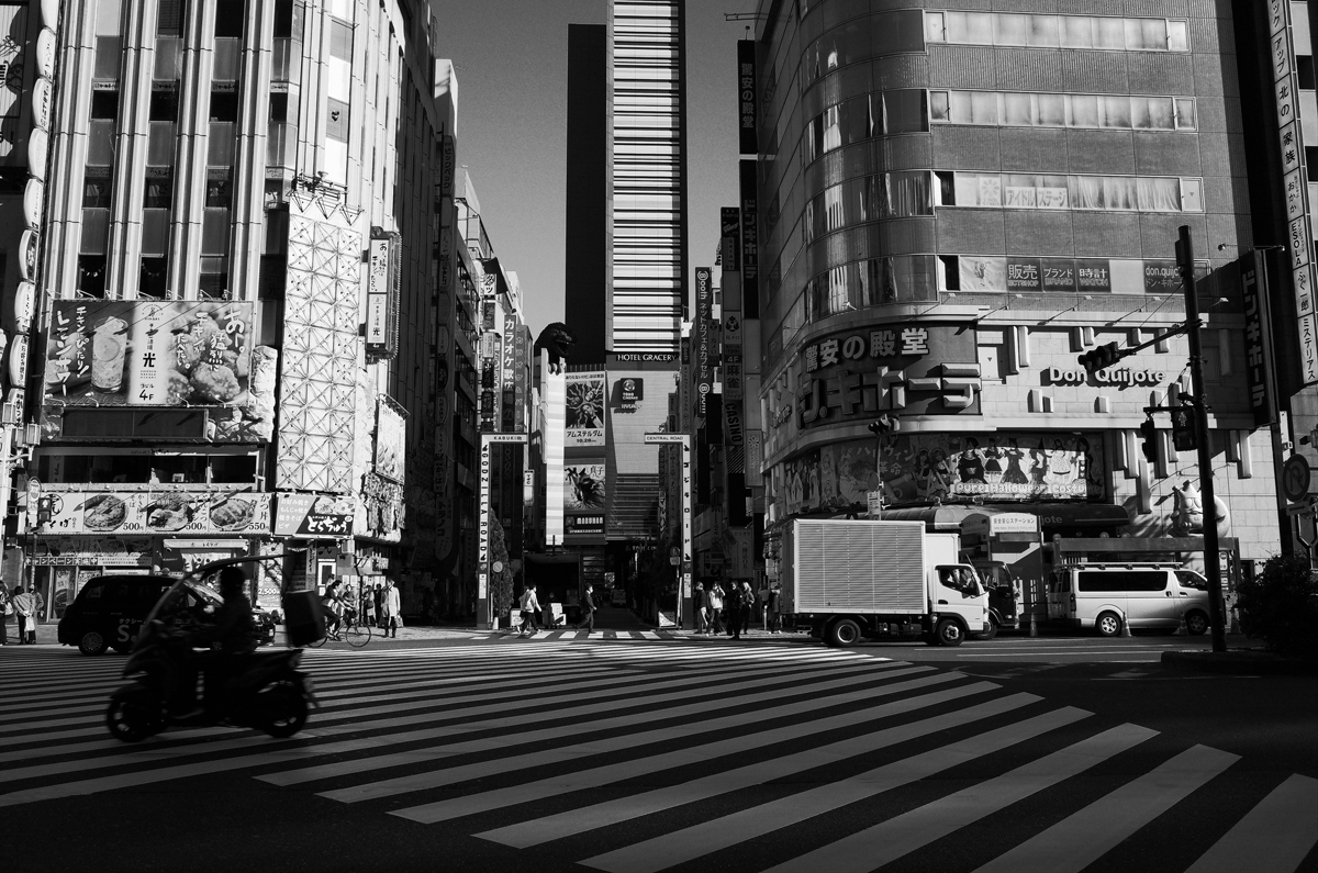 City street in Shinjuku with the Hotel Gracery in the background.