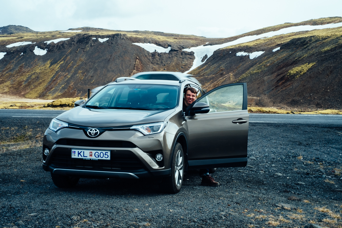 A man in a car in Iceland.