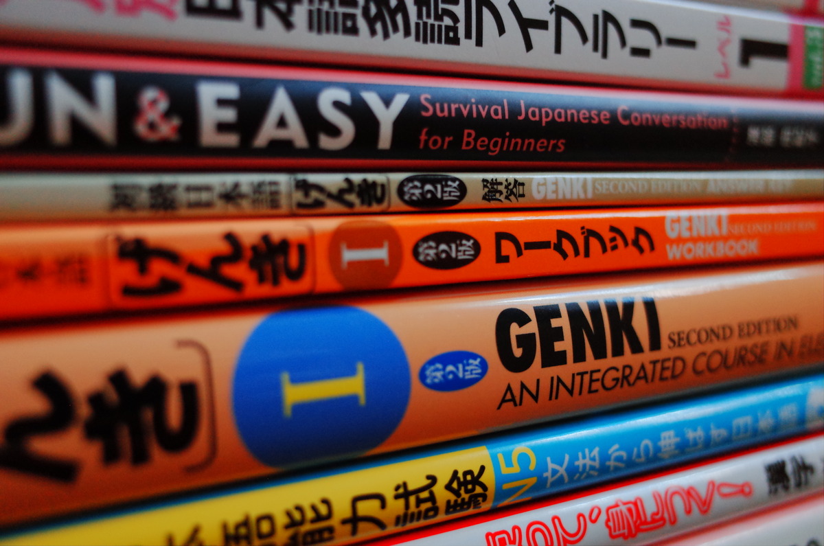 Stacked Japanese textbooks and graded readers.