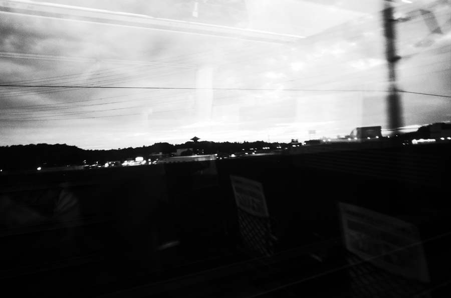 A night view of Narita, Japan from a train window.