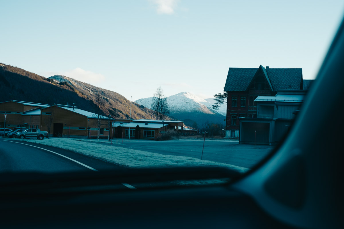 Distant mountains viewed from inside a car.