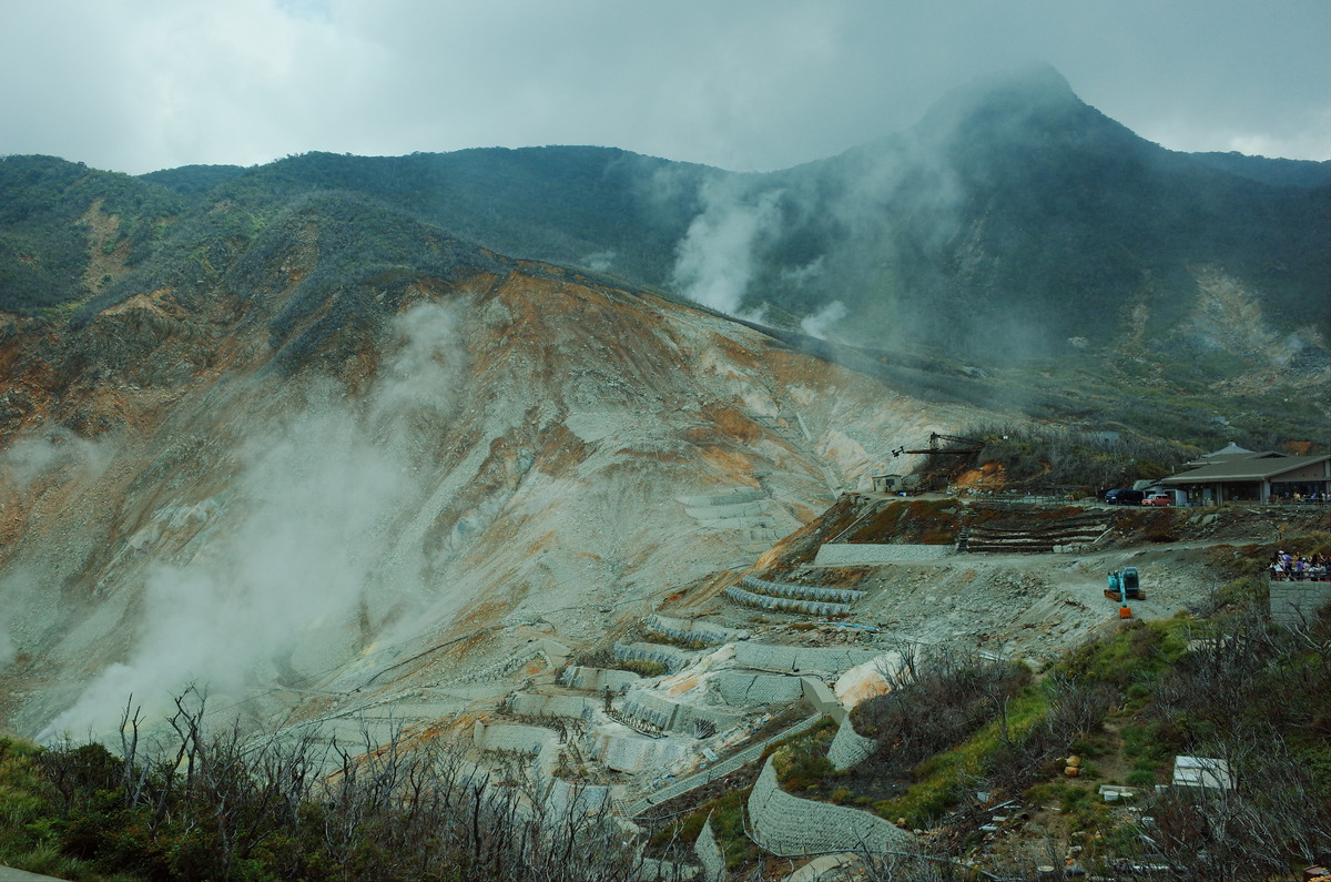 The volcanic valley of Owakudani with columns of steam.