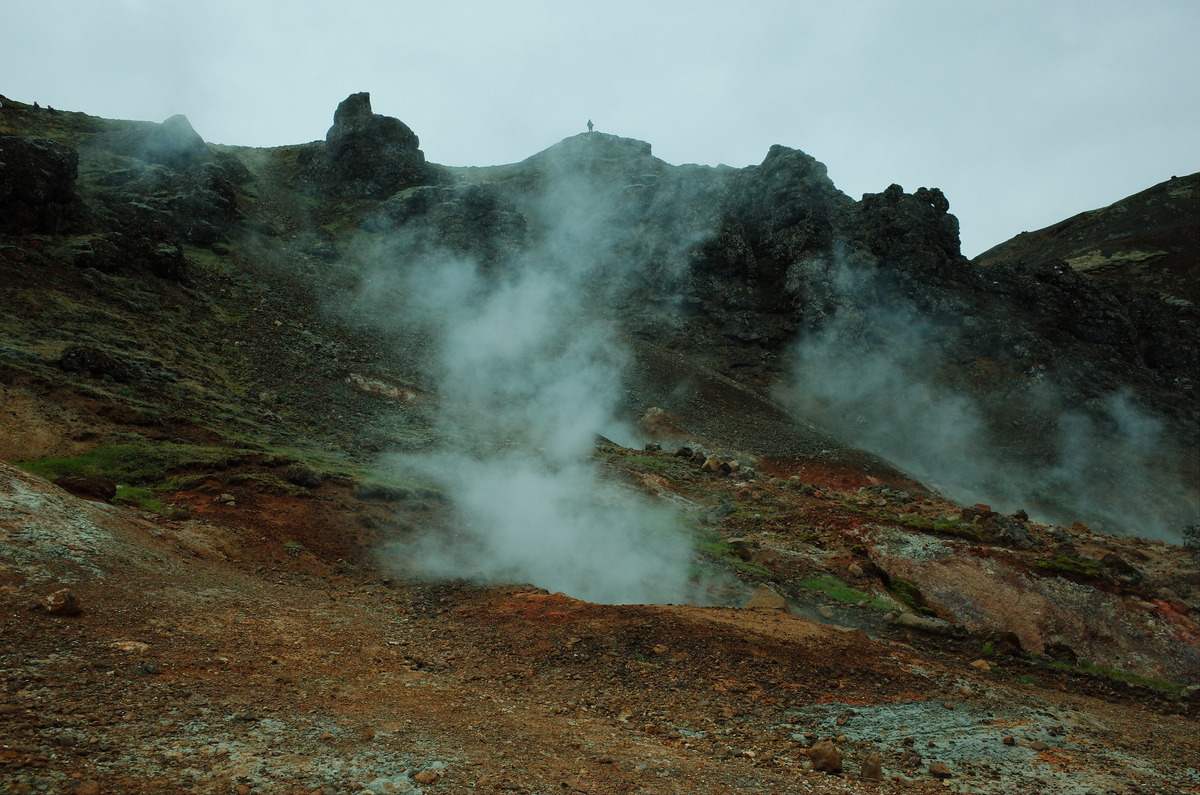 Pockets of geothermal steam rise in the Reykjadalur valley.
