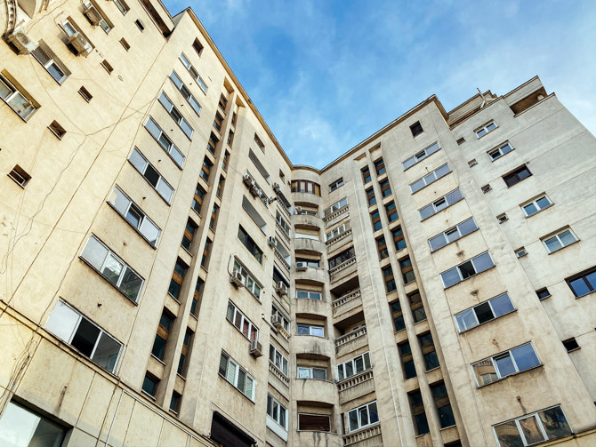 Yellow, Soviet-era apartment building in Bucharest, Romania.